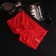 Boxer à transparent de couleur rouge avec son élastique noire 